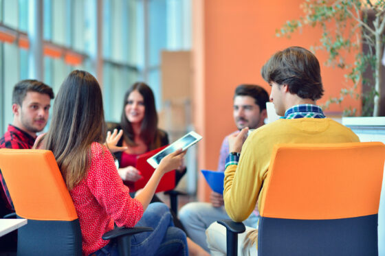 Group of young business professionals having a meeting.
